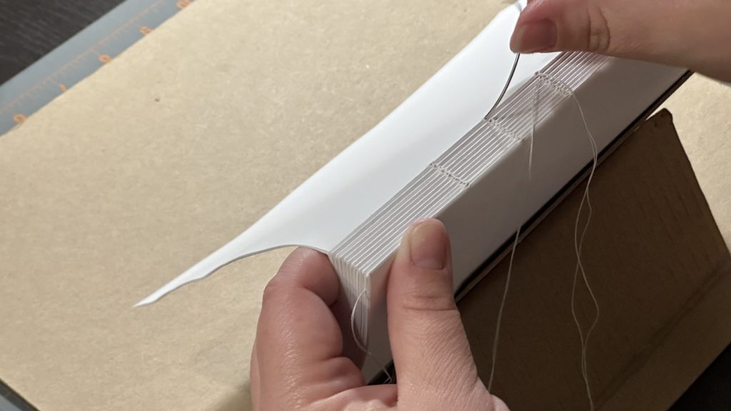 Hand sewing a book
